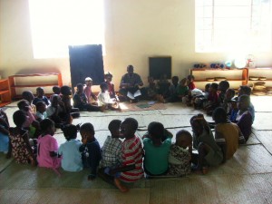 Simon teaching our kids about God! Simon was voted Best English Speaker this week by the staff, which earned him a candy bar! 