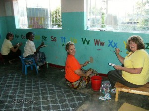 Cindy Dickson and Pam Loomis painting Chifundo III in 2009. These ladies return to Malawi this July 2011. Pegi Scarlet (far rt) Zikomo Pegi!